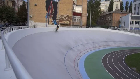 Cyclists are training on a professional velodrome outdoor. 15.09.2017 Ukraine Stock Footage 80248802