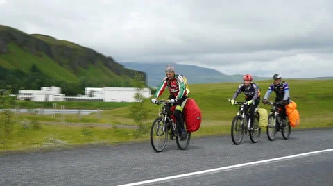 Cyclists on the background of the Icelandic landscape Stock Footage 59110655