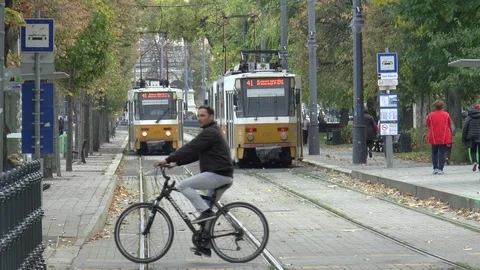 Cyclists Crossing Tram Tracks Stock Footage 99016735