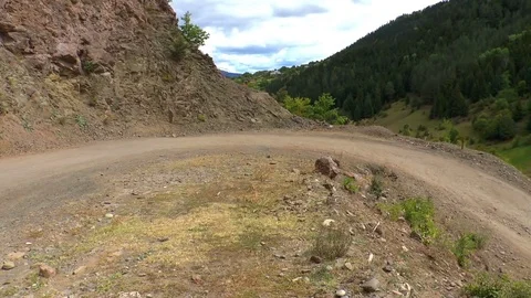 Cyclists down the mountain road Stock Footage 72272386
