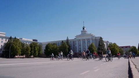 Cyclists drive through the Soviet square in the city of Ufa. Stock Footage 108897062