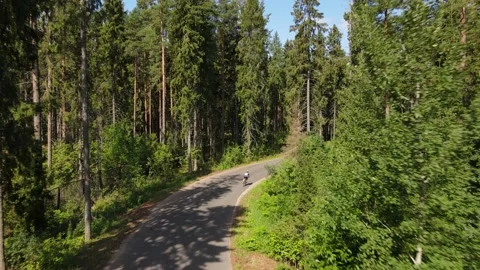 Cyclists on a forest road 動画素材 157892652