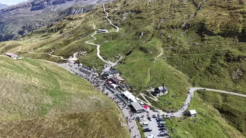 Cyclists Gathering Across Alpine Mountain Summit Stock Footage 345496007