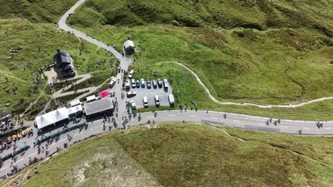 Cyclists Gathering at Klausenpass Mountain Summit Stock Footage 345496458