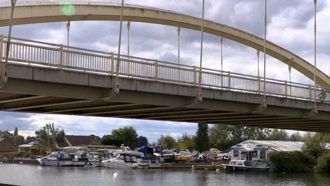 Cyclists go over bridge Stock Footage 118169820
