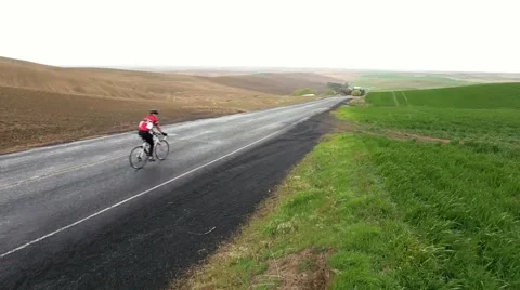 Cyclists going down hill Stock Footage 50452714