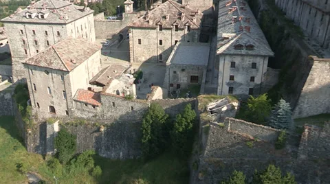 Cyclists going downhill in a castle Stock Footage 33195950