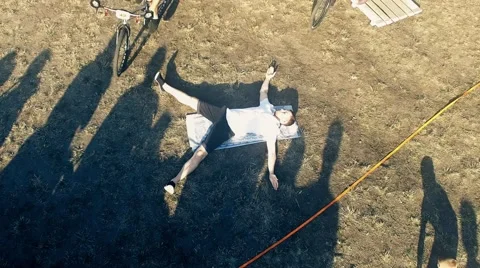 Cyclists jump over man in bicycle aerial HD video. tricks in Mountain bike trial Stock Footage 67861548