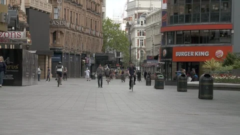 Cyclists in Leicester Square during Lockdown Londonwn London Stock Footage 129721268