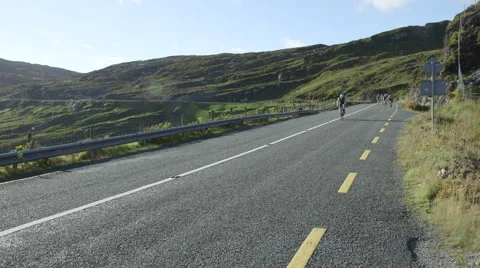 Cyclists on Mountain Road Stock Footage 55826587