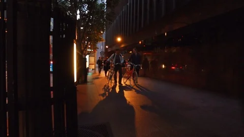 Cyclists on a pavement at night. 動画素材 88342705