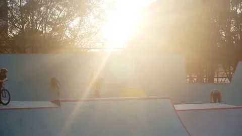 Cyclists perform the tricks in skate park together Video stock 103245180