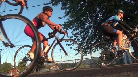 Cyclists in race pass camera Stock Footage 51843782