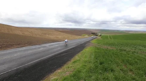 Cyclists racing downhill Stock Footage 50452574