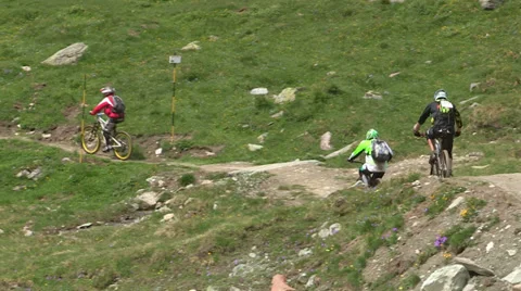 Cyclists racing In the mountains Stock Footage 33061592