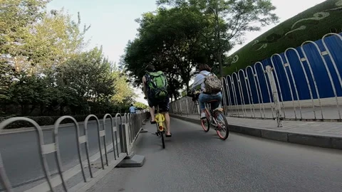 Cyclists ride along the path next to the road Video stock 102297217