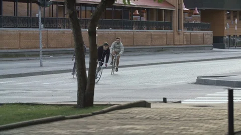 Cyclists ride fixed gear bicycles at city street. Ecological urban transport Stock Footage 108345431