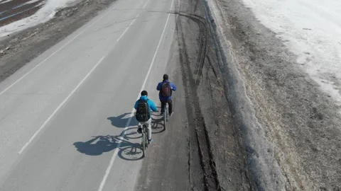 Cyclists ride on the road. 動画素材 151376358