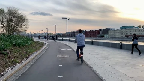 Cyclists ride on Strida through the spring streets of Moscow Stock Footage 107274054