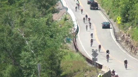 Cyclists Ride Toward Camera Hilly Rural Road in Triathlon Video stock 52327851