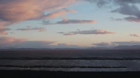 Cyclists rides by a beautiful Coastal View Stock Footage 71237250