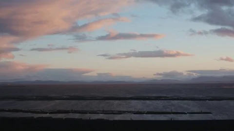 Cyclists rides by a beautiful Coastal View Stock Footage 71237320