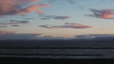 Cyclists rides by a beautiful Coastal View Stock Footage 71237443
