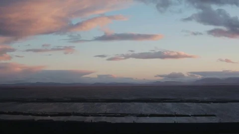 Cyclists rides by a beautiful Coastal View Stock Footage 71237472