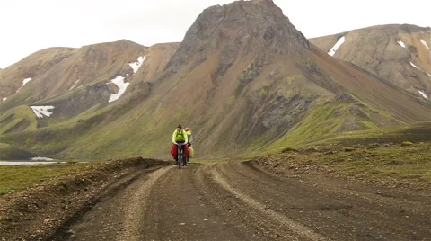 Cyclists rides in Iceland Stock Footage 58674548