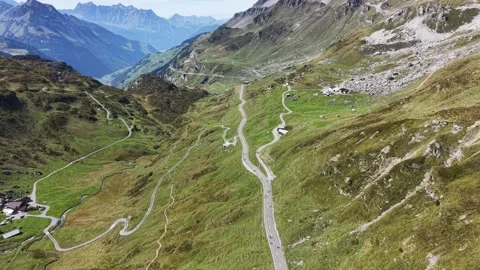 Cyclists Riding Along Scenic Alpine Mountain Ridge Stock Footage 345496243