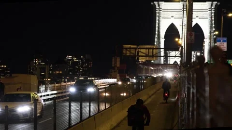 Cyclists riding bicycle across brooklyn bridge in manhattan new york city Video stock 303592011