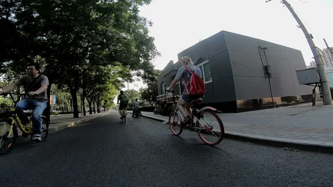Cyclists riding on bicycle path 스톡 동영상 102297466