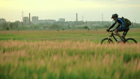 Cyclists riding bicycles Stock Footage 76595346