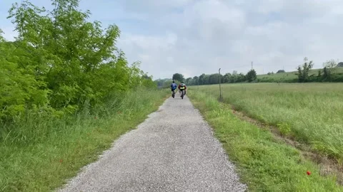Cyclists Riding on a Dedicated Cycle Path, Pozzolo,5may2024, Pozollo, Italy Stock Footage 281251315