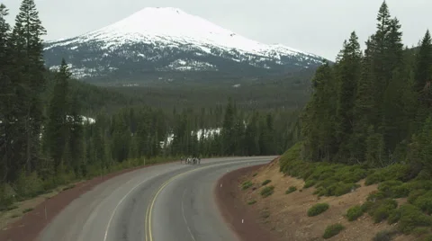 Cyclists riding on mountain road Stock Footage 58519005