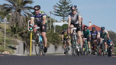 Cyclists riding in a pack on the road during a race, 4K 50p. Stock-Footage 162662808