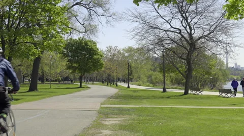 Cyclists riding in the Park. 4K UHD. 스톡 동영상 50586517