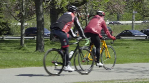 Cyclists riding in the Park. 4K UHD. Stock-Footage 50588378