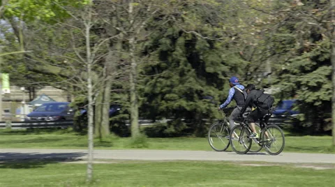 Cyclists riding in the Park. 4K UHD. Stock-Footage 50590525