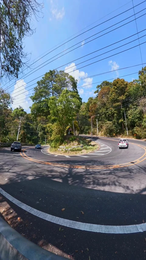 Cyclists Riding Through Mountain Curve on Doi Suthep Road Video stock 327463740