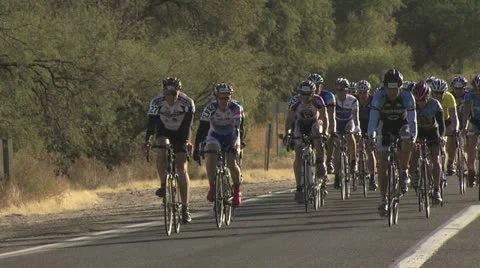 Cyclists In A Road Race Taking A Right Turn Video stock 19140570