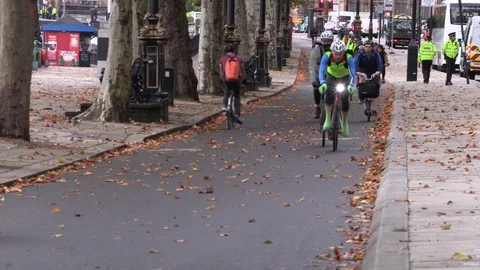 Cyclists at rush hour in Autumn Stock Footage 118396129
