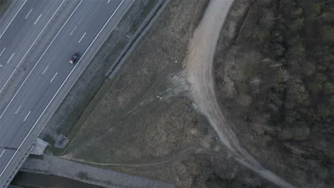 Cyclists stand on a halt at the side of the road Stock Footage 114080875