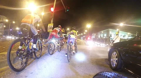 Cyclists stop at traffic light Stock Footage 39983407