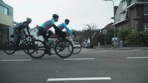 Cyclists Taking A Left Turn On The Road At Valkenburg Stock Footage 130676638