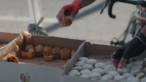 Cyclists Taking Snacks at Feed Station During Cycling Race Video stock 333698344