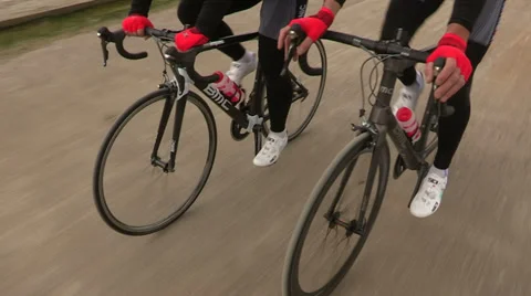 Cyclists training on sandy road Stock Footage 37568804