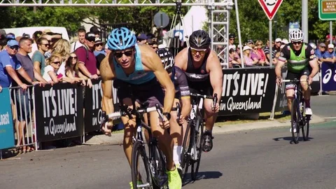 Cyclists on a triathlon race Stock Footage 80013644