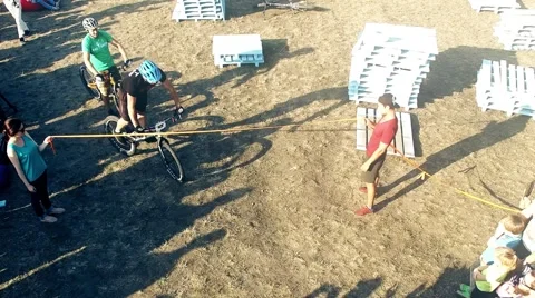 Cyclists tricks jumping MTB bicycle HD aerial video. Mountain bike trial Stock Footage 67861590