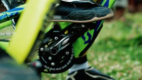 Cyclists turn pedals to prepare to start riding. Stock Footage 70507336